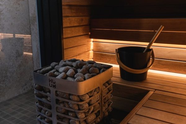 a bucket of rocks sitting on top of a wooden floor